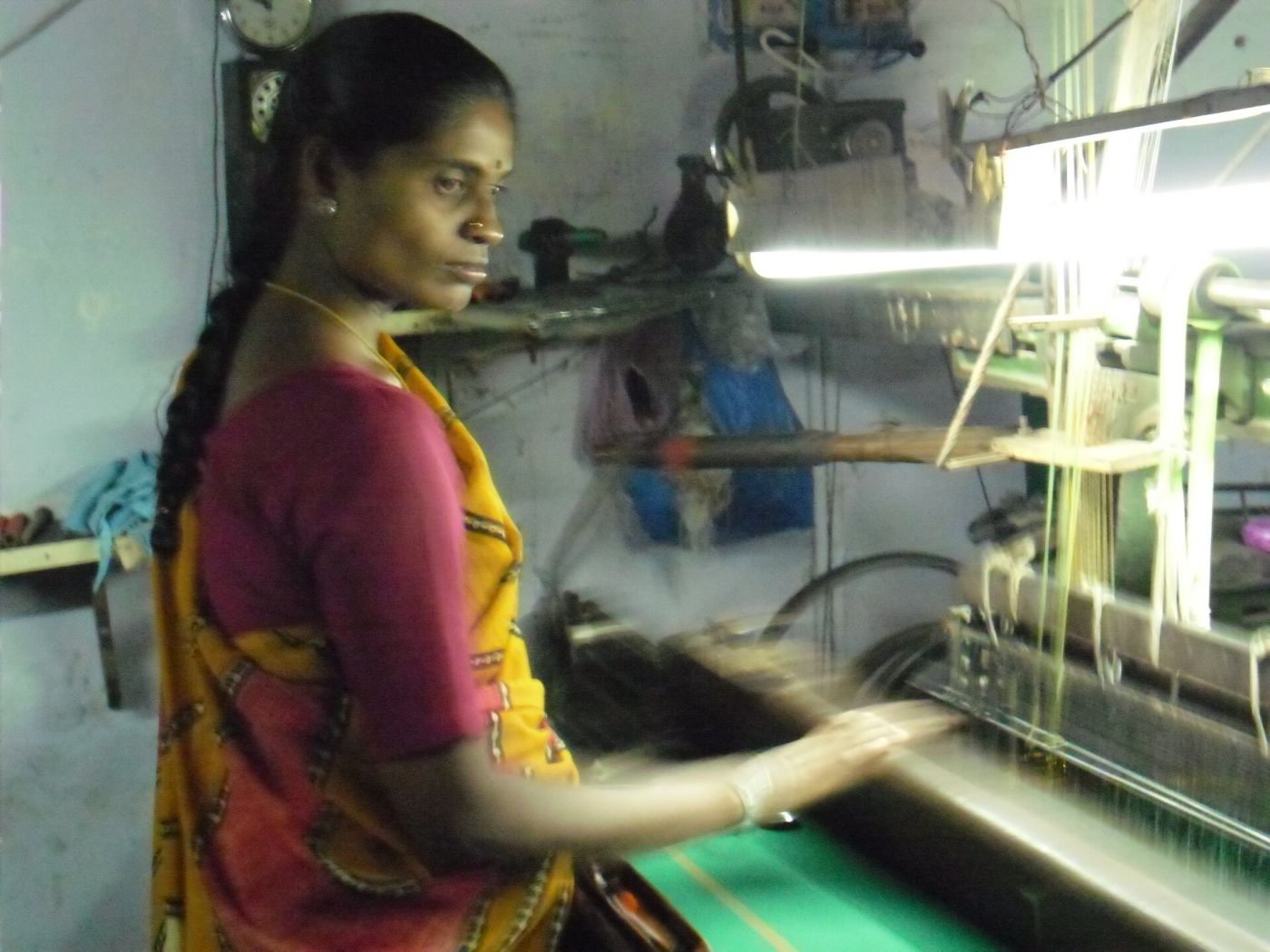 A weaver at her loom